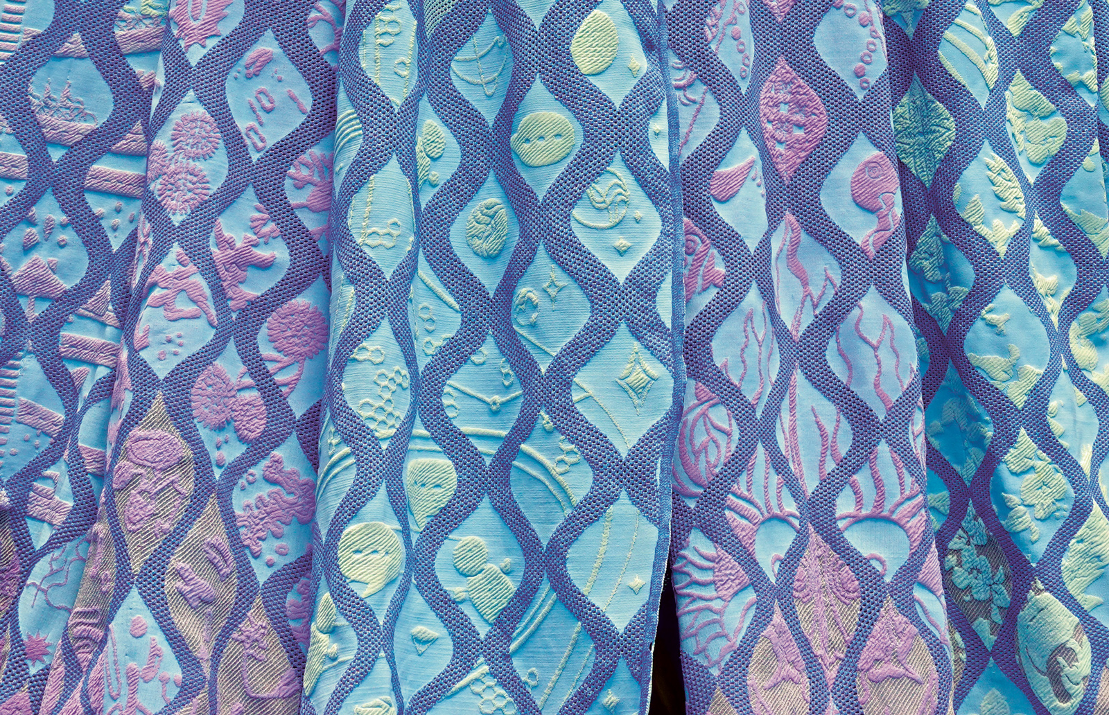 MIT-style textile research lab with advanced weaving and fabric technology equipment